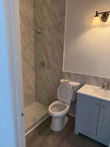 a bathroom with a toilet and a sink