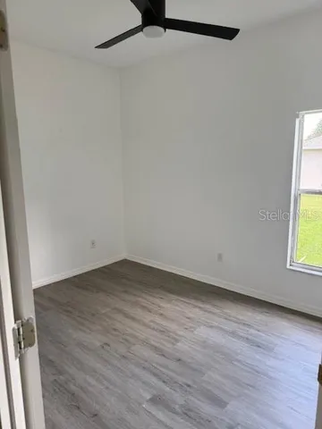 a view of a room that has wooden floor in it