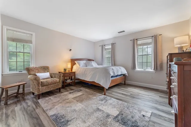 a bedroom with a bed and a couch