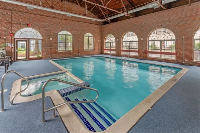 a view of a balcony with two chairs and a table