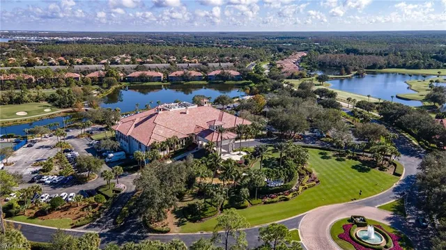 an aerial view of lake and residential houses with outdoor space