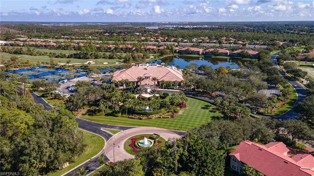 an aerial view of a house with a lake view