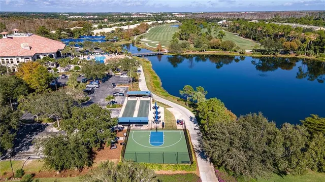an aerial view of a house with a lake view