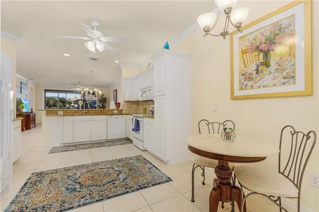 a living room with kitchen and a dining table