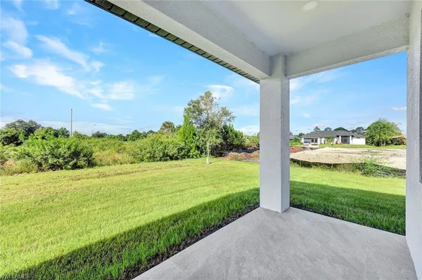 a view of a field with an ocean view