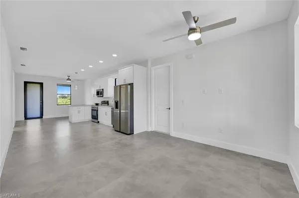a view of a livingroom with a kitchen