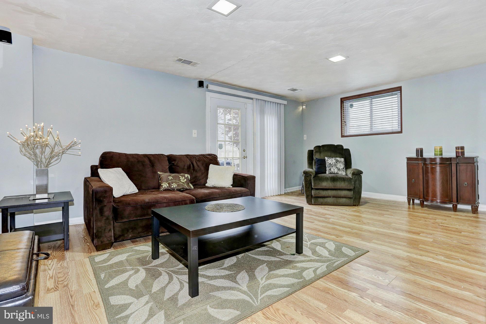 3303 Greenmead Road Windsor Mill, MD 21244 - Photo 11 of 20 a living room with furniture and wooden floor