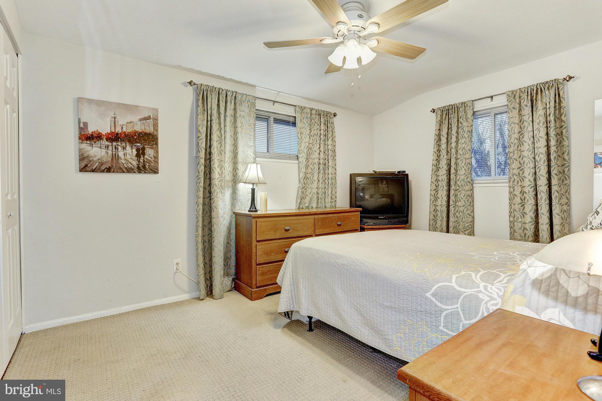 3303 Greenmead Road Windsor Mill, MD 21244 - Photo 17 of 20 a bedroom with a bed and lamp