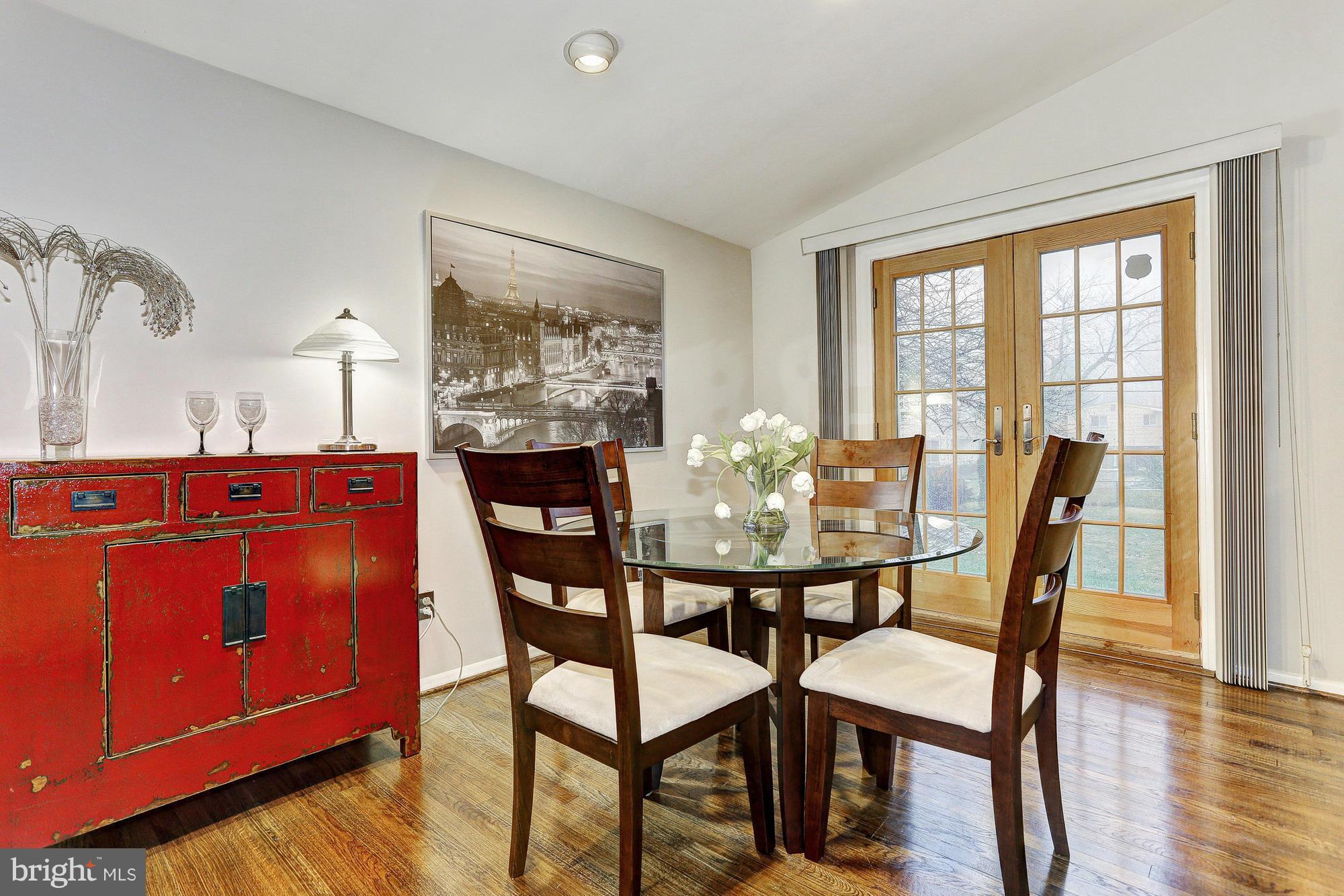 3303 Greenmead Road Windsor Mill, MD 21244 - Photo 6 of 20 a view of a dining room with furniture and wooden floor
