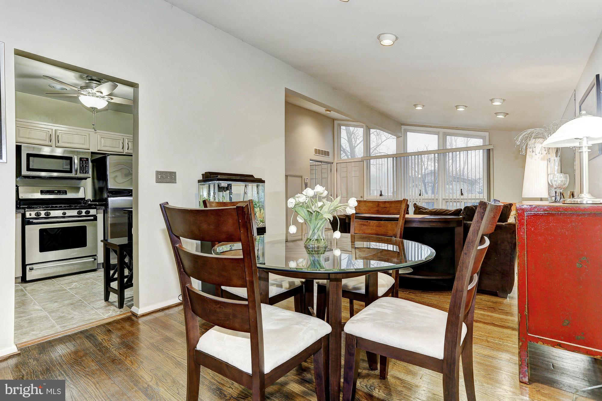 3303 Greenmead Road Windsor Mill, MD 21244 - Photo 7 of 20 a view of a dining room with furniture and wooden floor