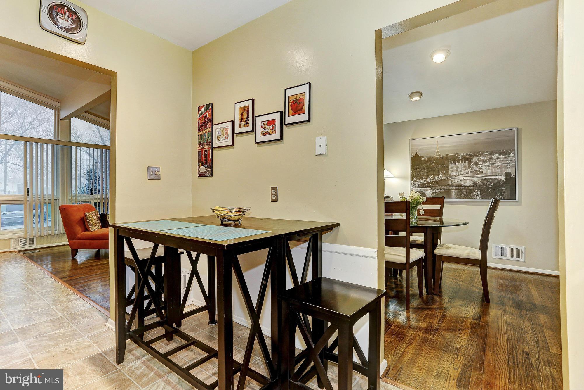 3303 Greenmead Road Windsor Mill, MD 21244 - Photo 10 of 20 a view of a dining room with furniture and wooden floor