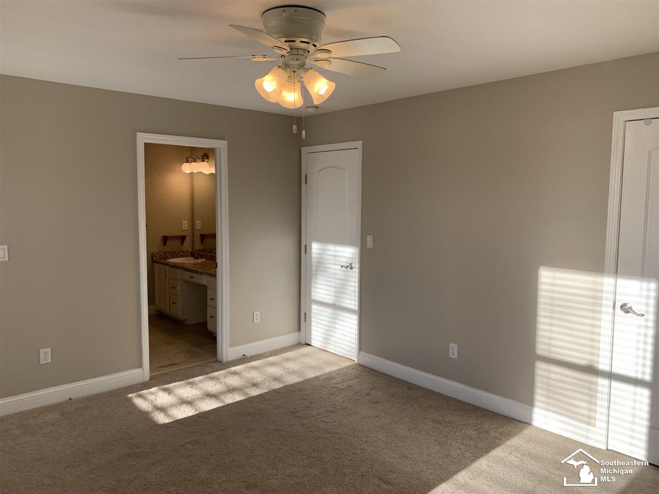 10412 Bacon Road Petersburg, MI 49270 - Photo 26 of 95 Master Suite on main floor featuring a his and hers closet and Master Bath.