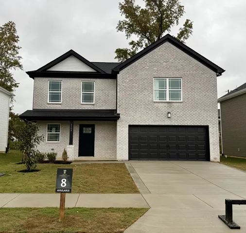 a front view of a house with garage