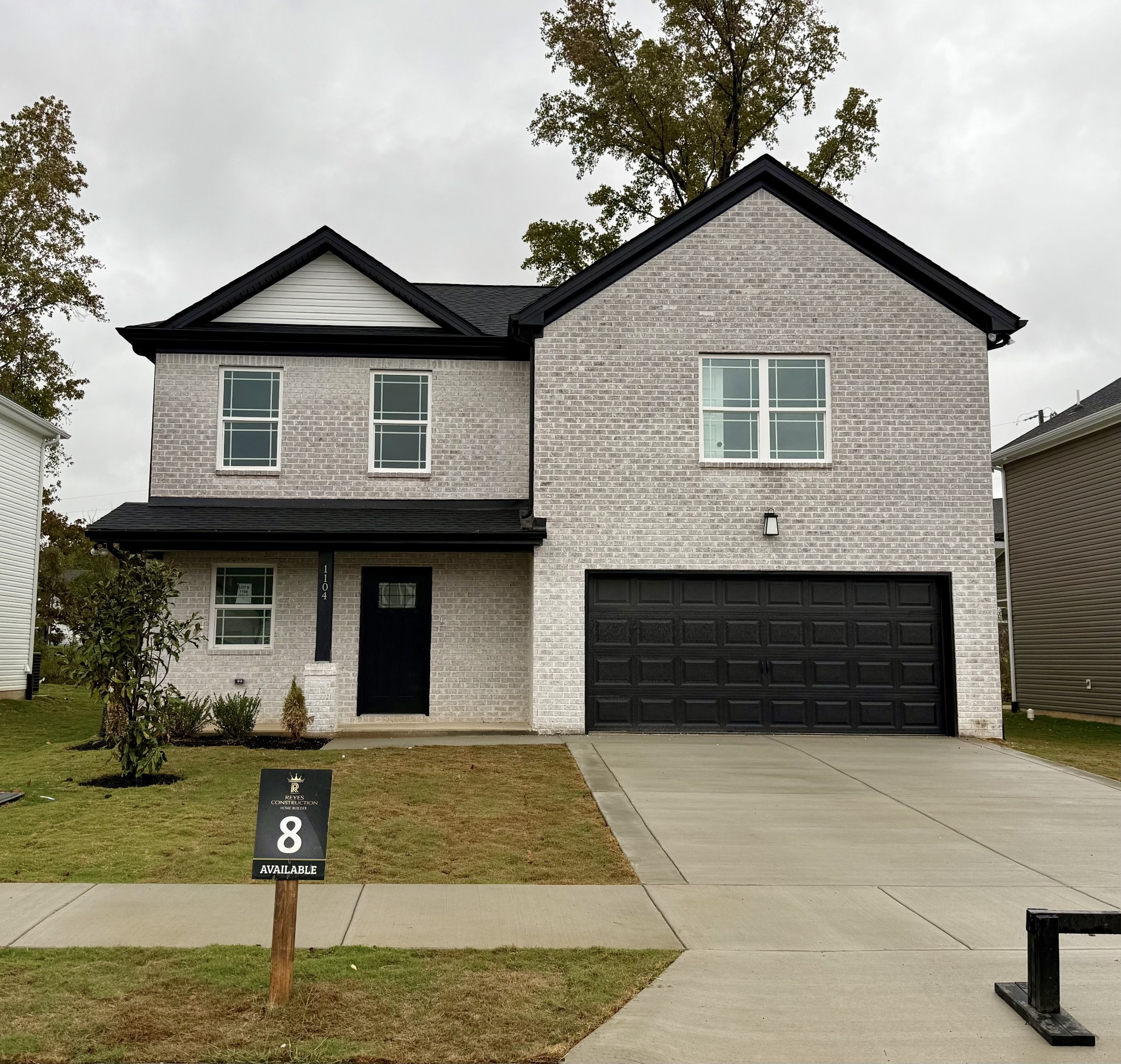 a front view of a house with garage