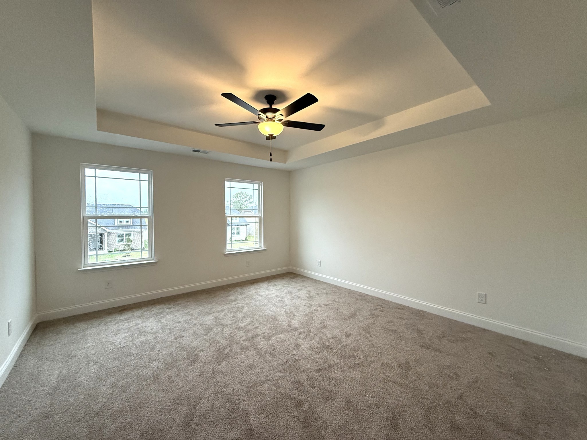 1104 Javier Drive Springfield, TN 37172 - Photo 3 of 5 an empty room with windows and chandelier fan