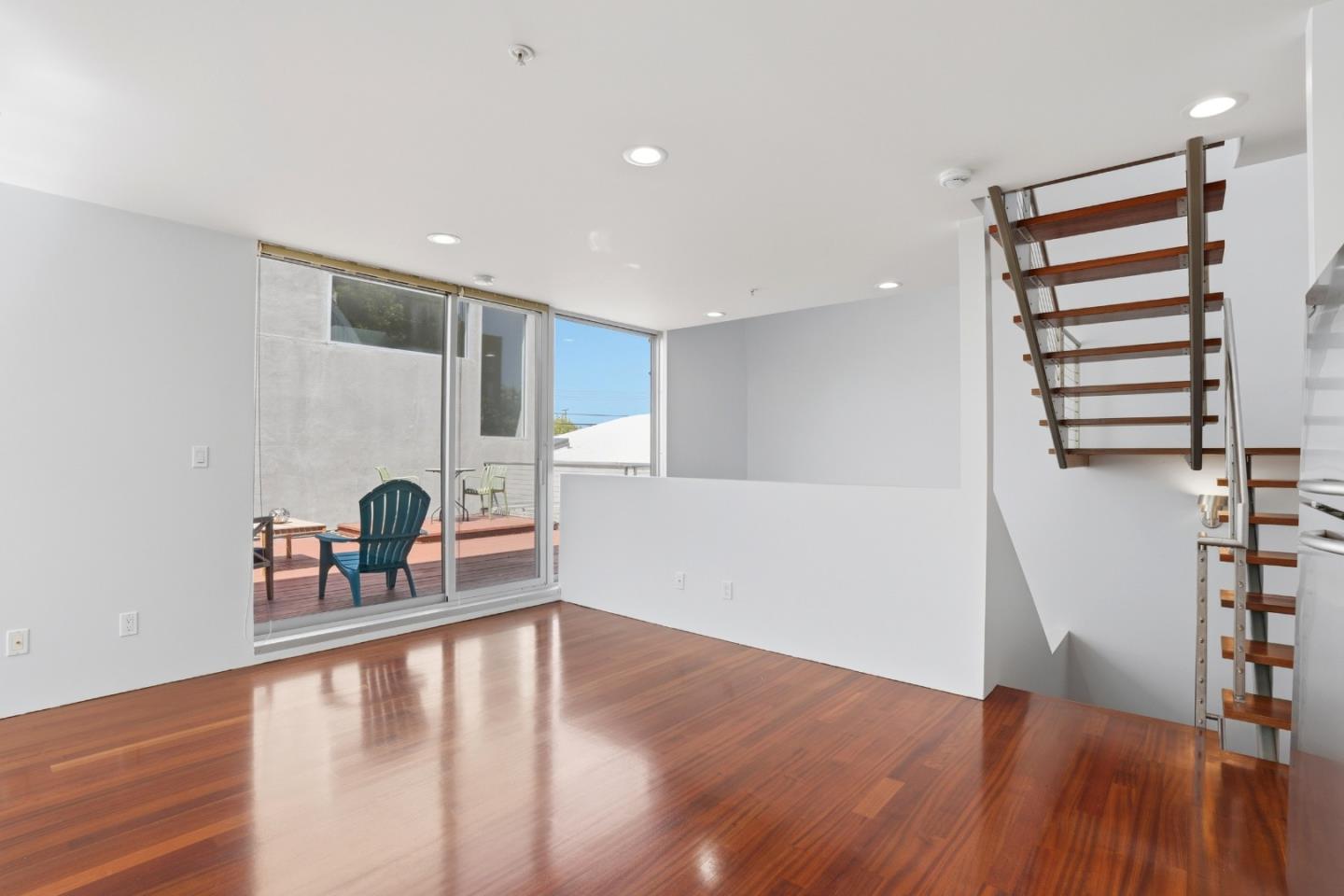 2709 Tenth Street, Unit C Berkeley, CA 94710 - Photo 21 of 44 a view of a hallway with wooden floor and staircase