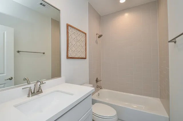 a bathroom with a sink toilet and bathtub