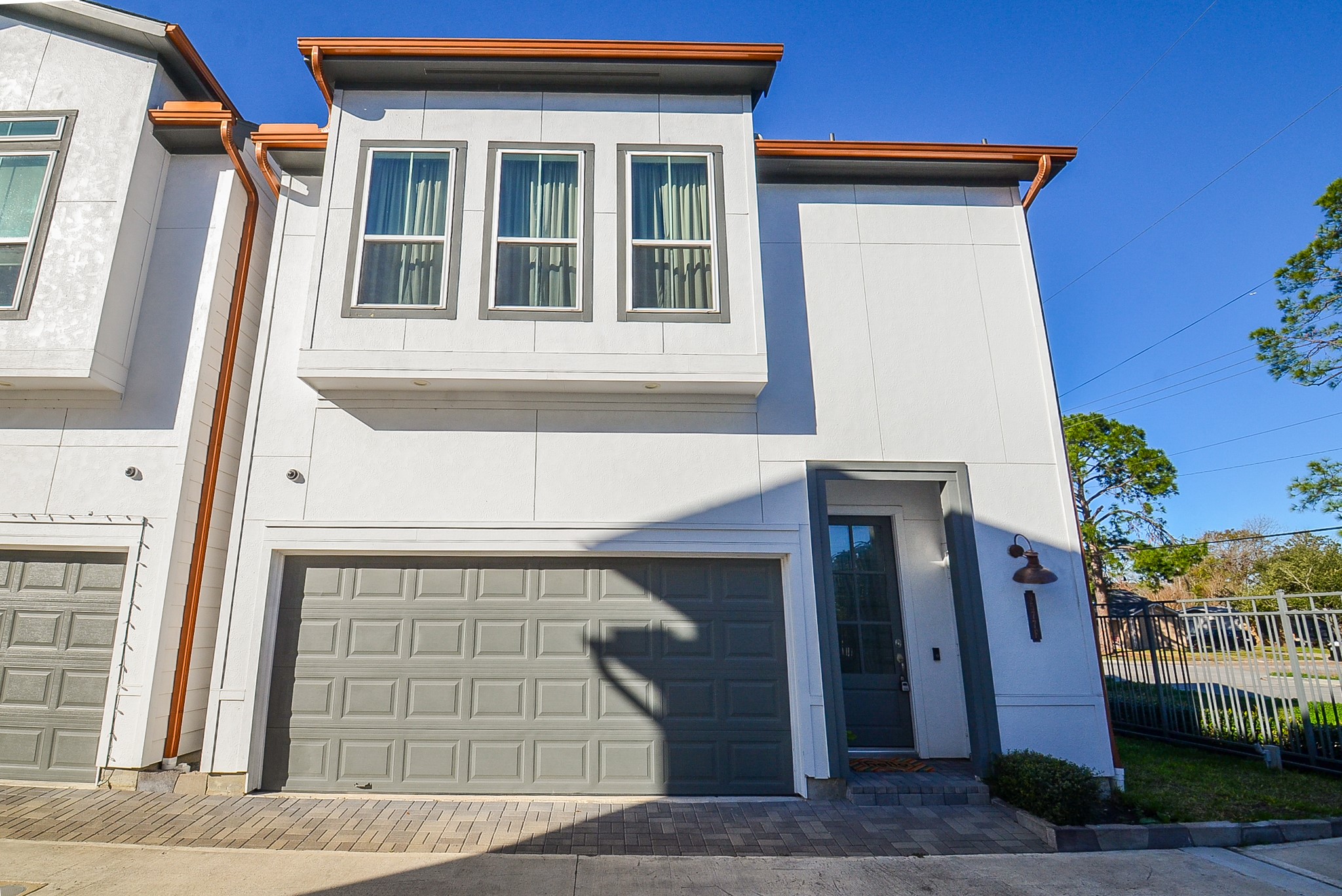 9577 Neuens Road, Unit F Houston, TX 77080 - Photo 4 of 26 a front view of a house with a garage