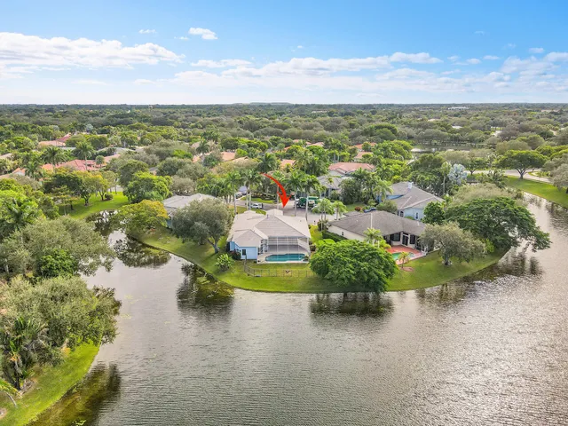 a living room with furniture a rug and white walls