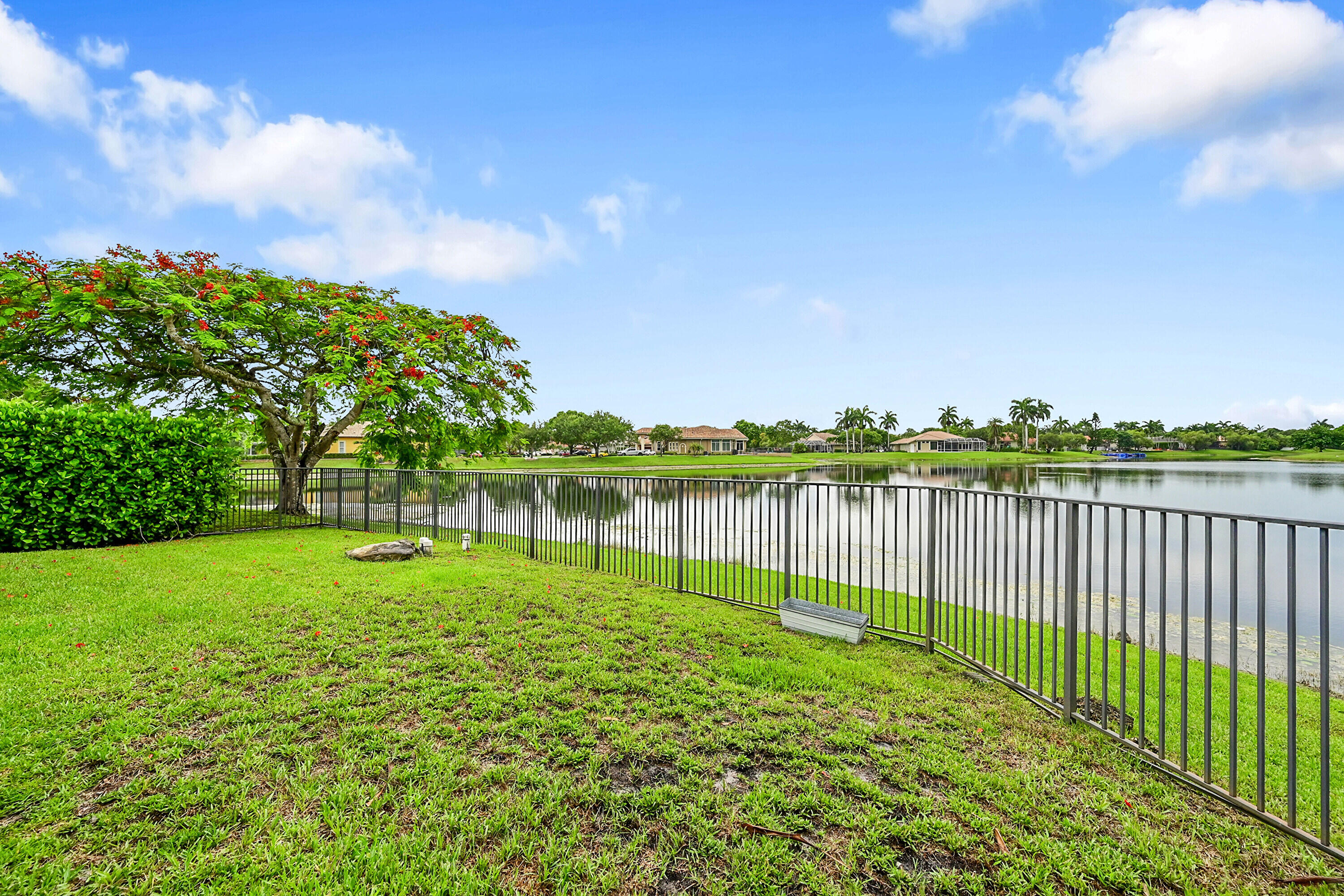 6419 Northwest 99th Drive Parkland, FL 33076 - Photo 4 of 17 a view of a lake with a big yard