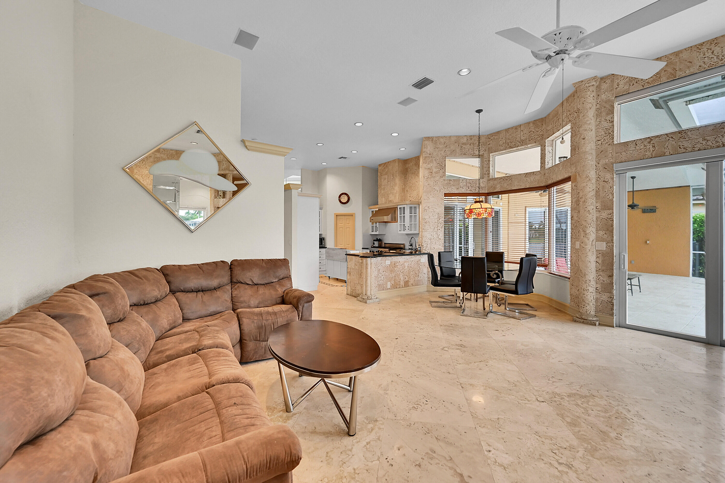 6419 Northwest 99th Drive Parkland, FL 33076 - Photo 8 of 17 a living room with furniture a rug and white walls