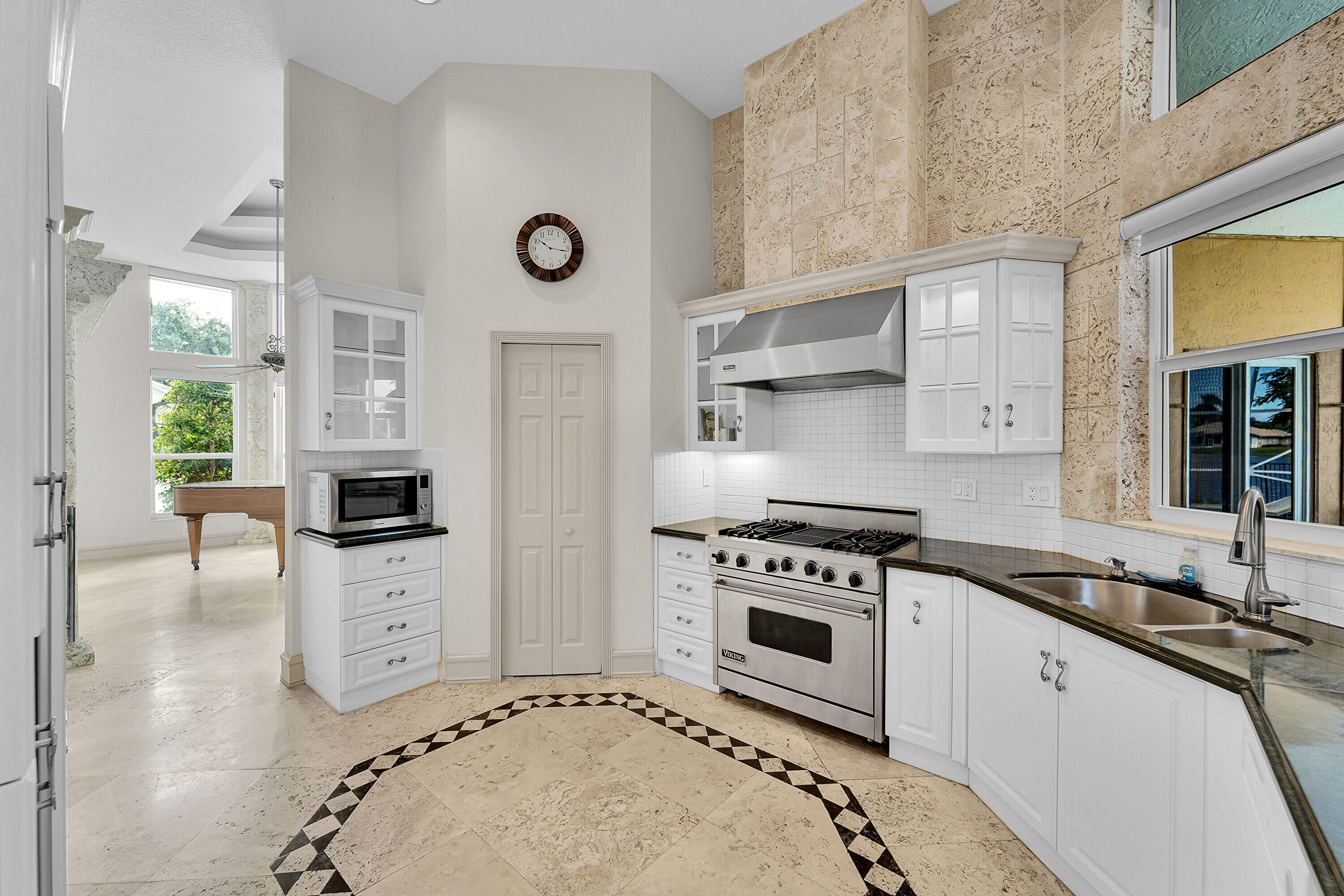 6419 Northwest 99th Drive Parkland, FL 33076 - Photo 9 of 17 a kitchen with stainless steel appliances a stove a sink and a refrigerator