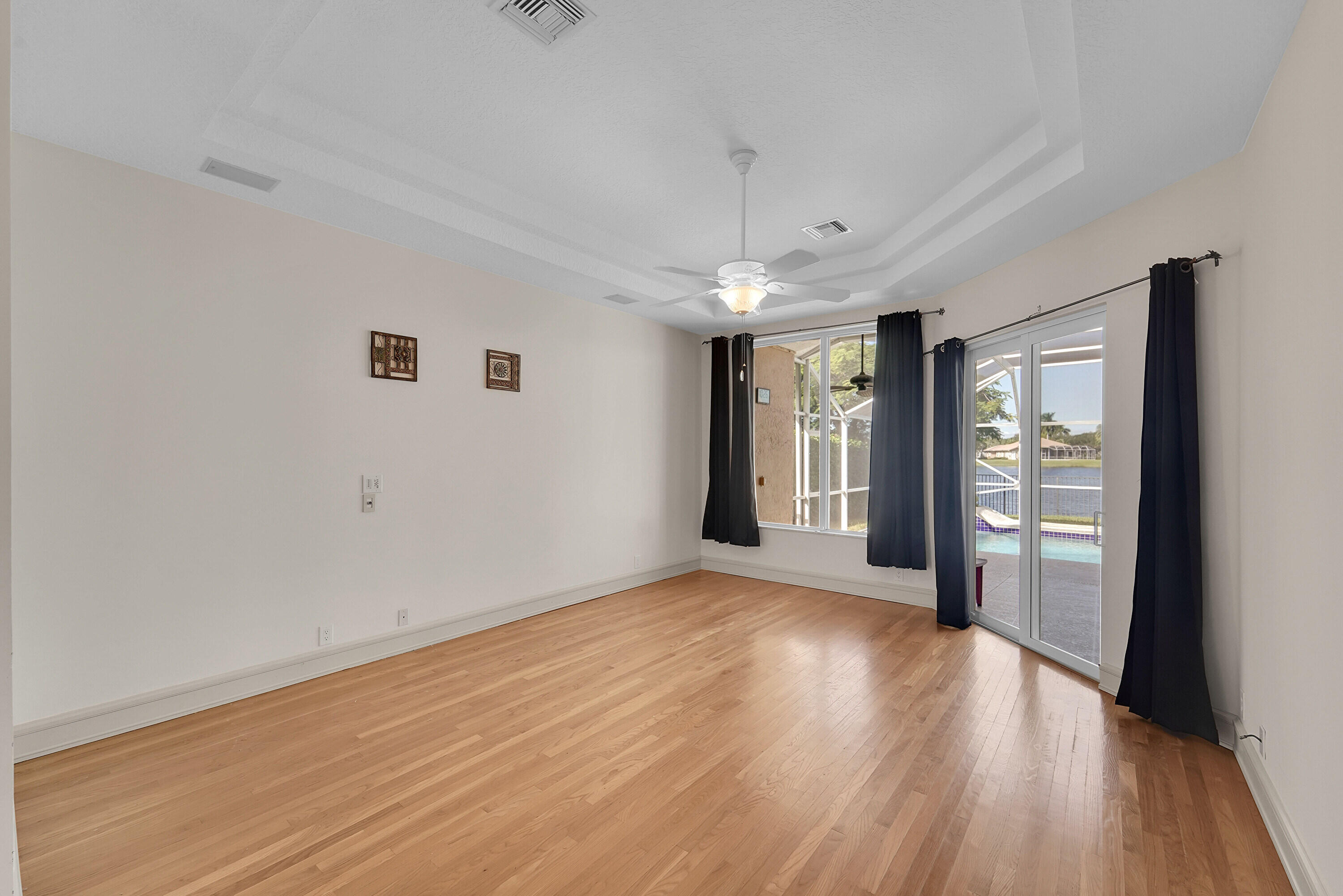 6419 Northwest 99th Drive Parkland, FL 33076 - Photo 10 of 17 wooden floor in an empty room with a window