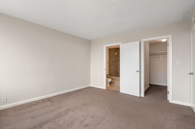 a view of an empty room and closet area