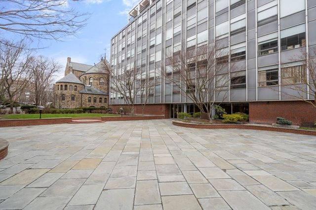 a view of a building with a yard