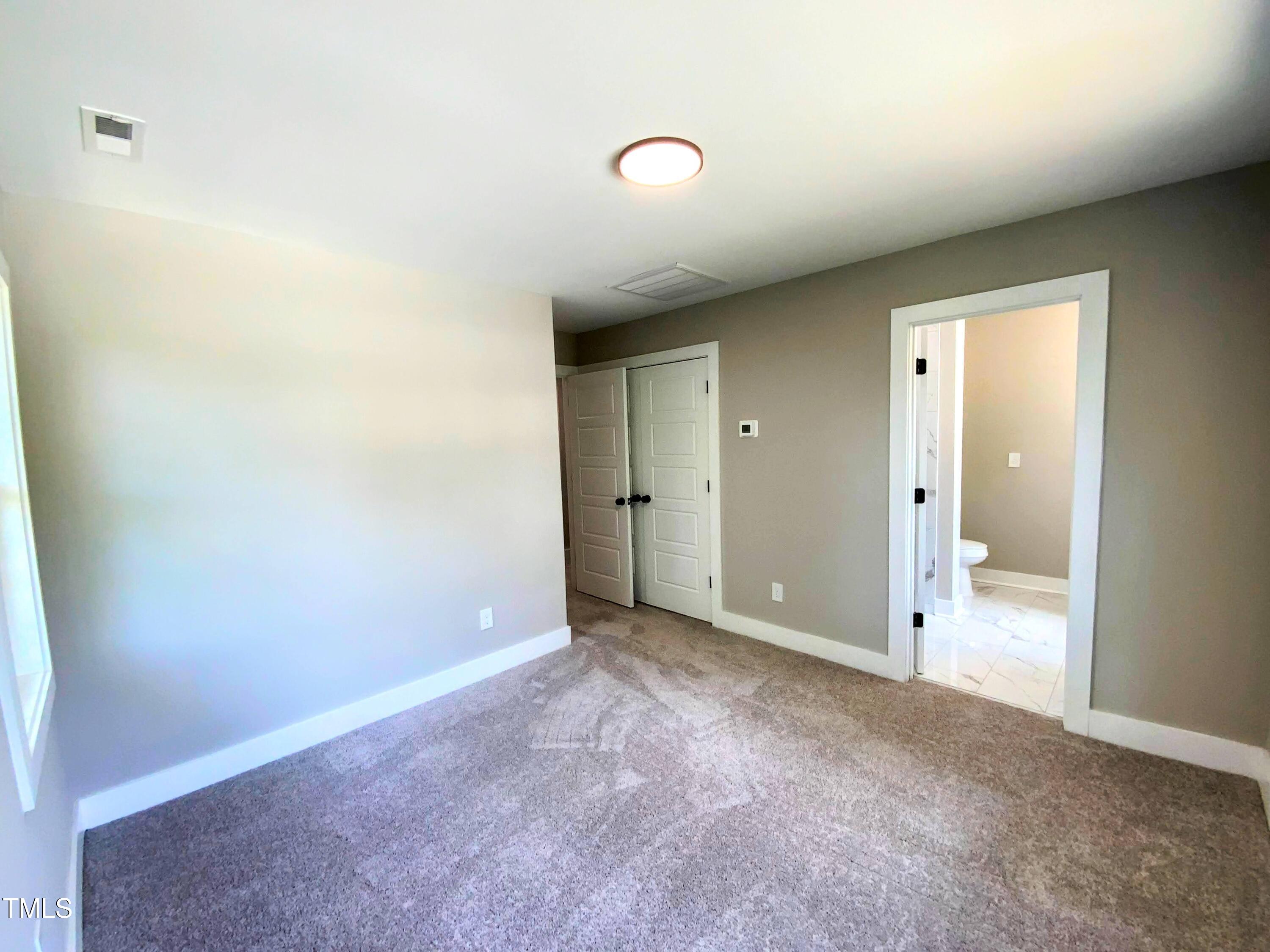608 East Umstead Street Durham, NC 27701 - Photo 13 of 20 an empty room with an entryway