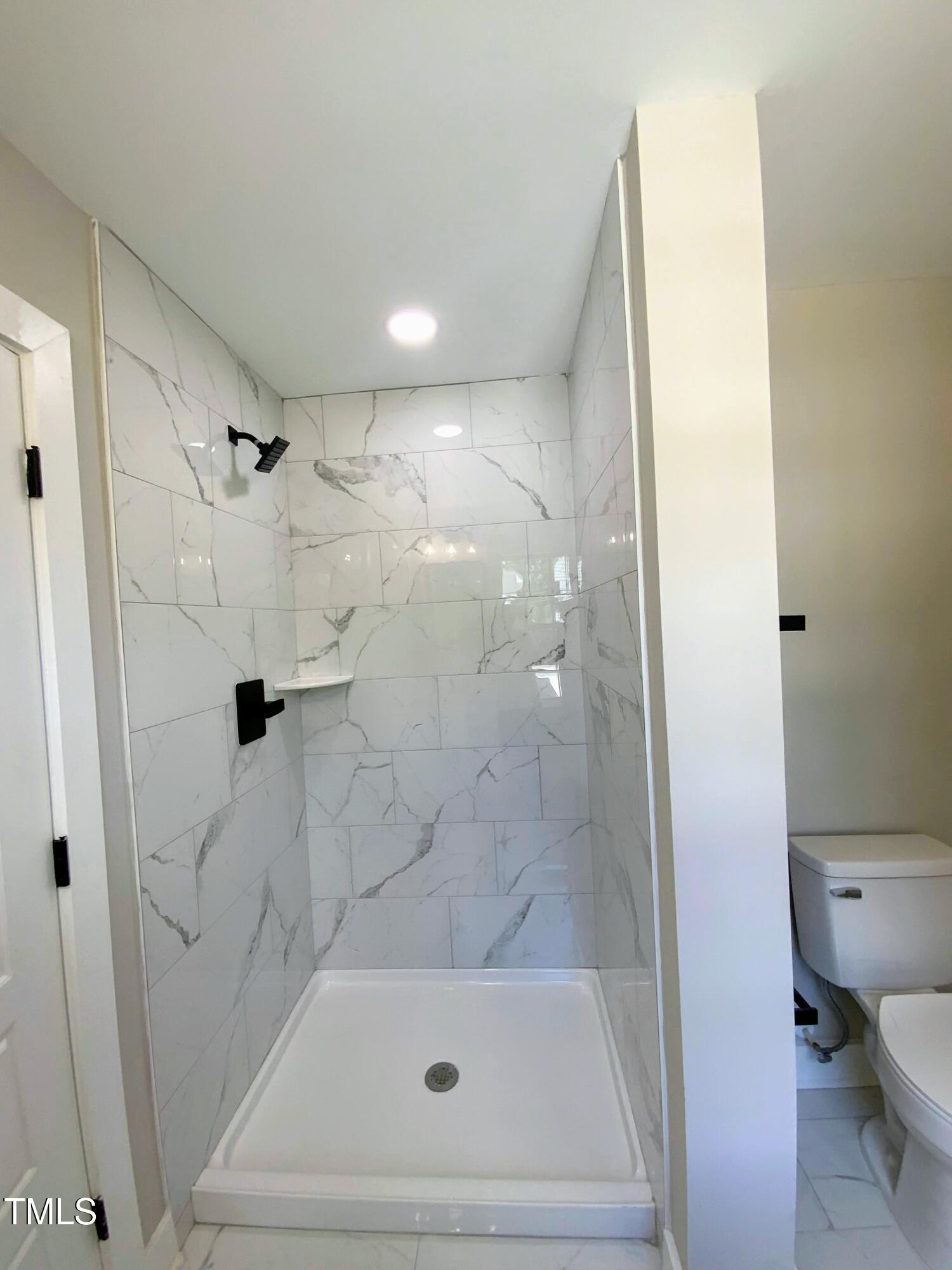 608 East Umstead Street Durham, NC 27701 - Photo 15 of 20 a bathroom with a shower and a toilet