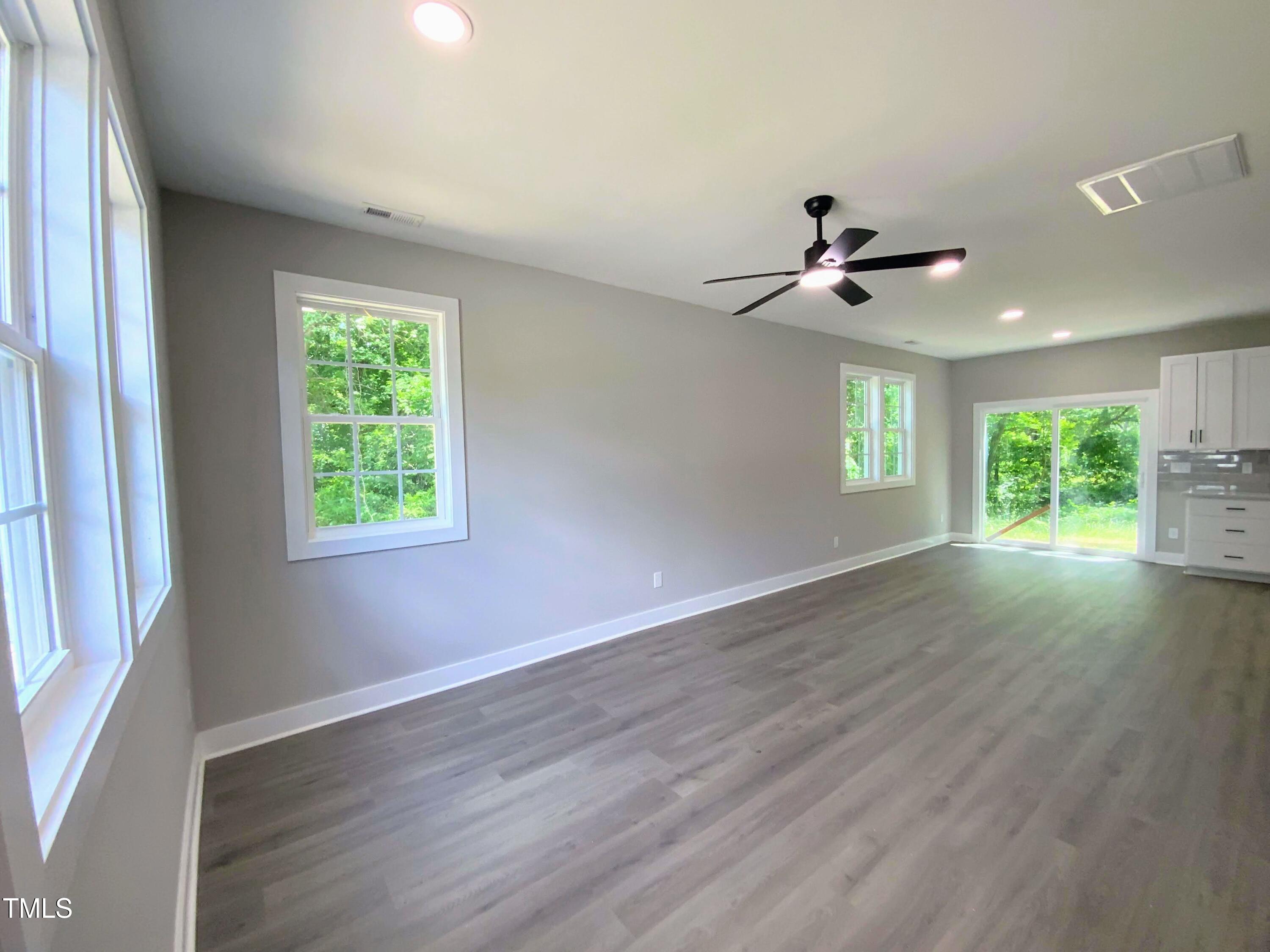608 East Umstead Street Durham, NC 27701 - Photo 4 of 20 a view of an empty room with a window