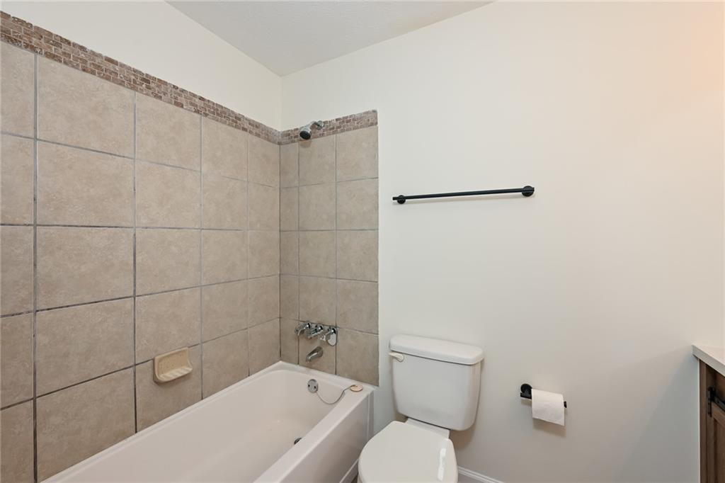 201 Lenox Way Northeast Atlanta, GA 30324 - Photo 12 of 15 a bathroom with a toilet and shower