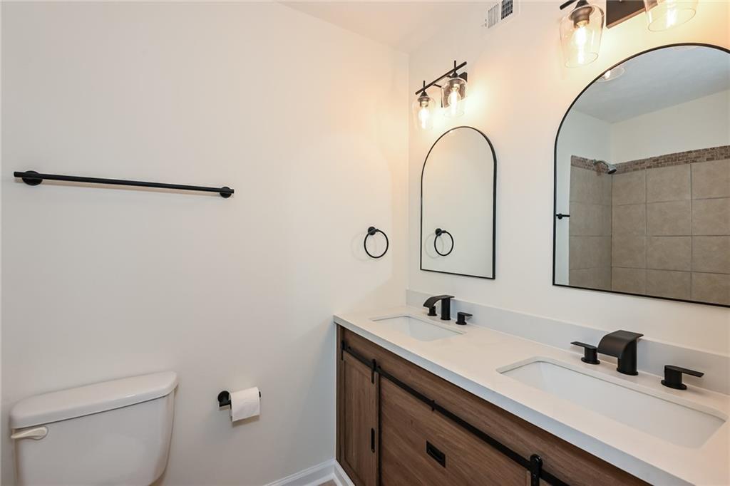 201 Lenox Way Northeast Atlanta, GA 30324 - Photo 10 of 15 a bathroom with a sink and a mirror