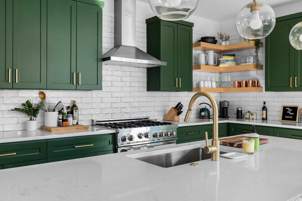404 Powell Circle, Unit B Austin, TX 78704 - Photo 11 of 33 a kitchen with stainless steel appliances granite countertop a sink and a stove next to a white cabinet