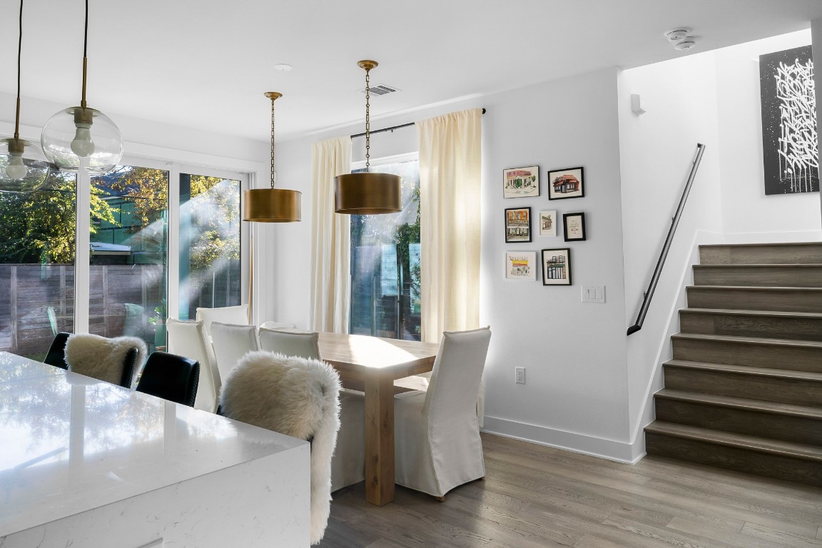 404 Powell Circle, Unit B Austin, TX 78704 - Photo 14 of 33 a view of dining room and wooden floor