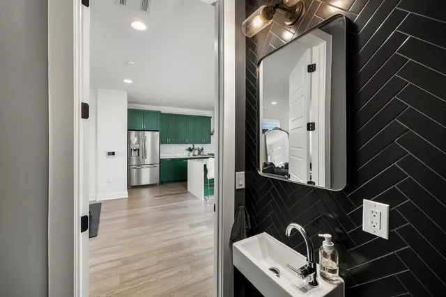 a bathroom with a sink and a mirror
