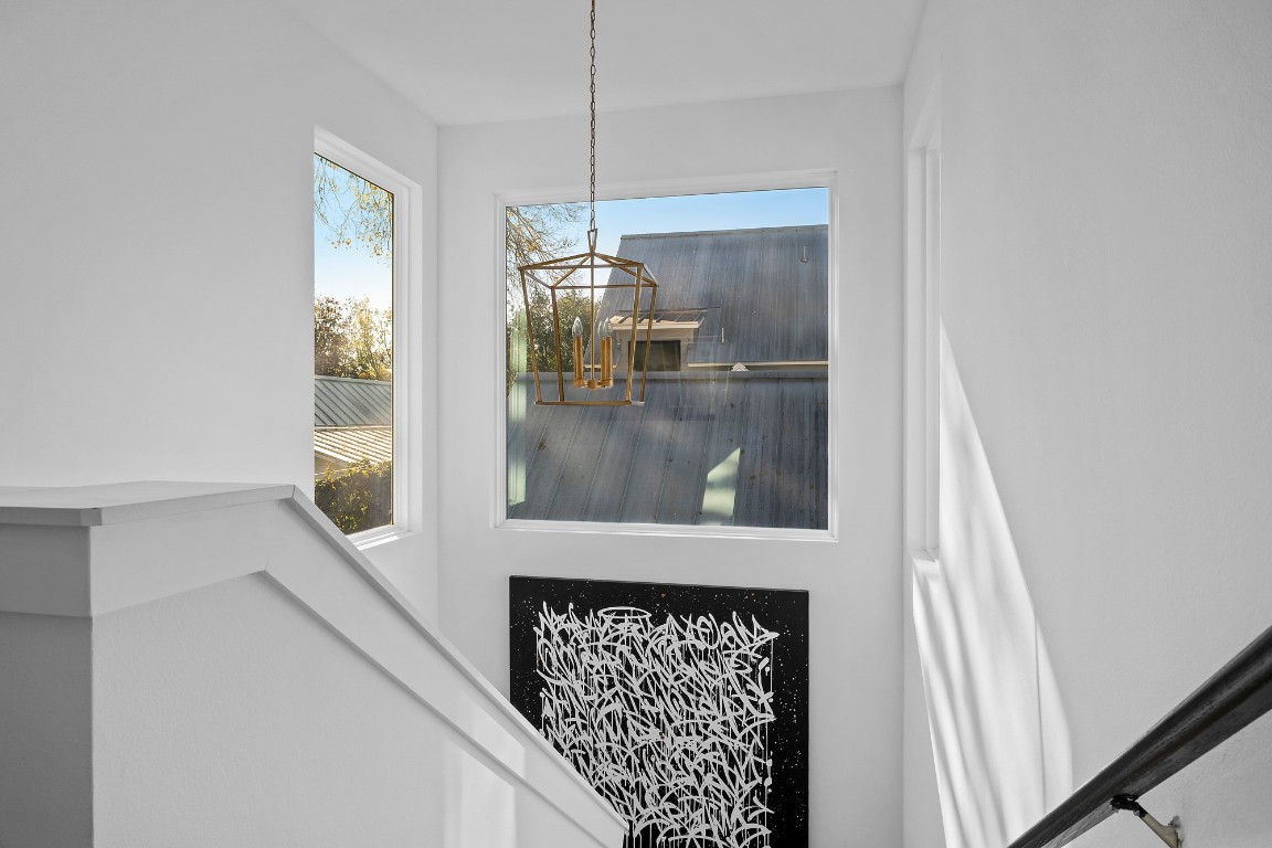 404 Powell Circle, Unit B Austin, TX 78704 - Photo 17 of 33 a picture of a room with a floor to ceiling window and a kitchen view