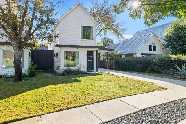 a view of house with a swimming pool