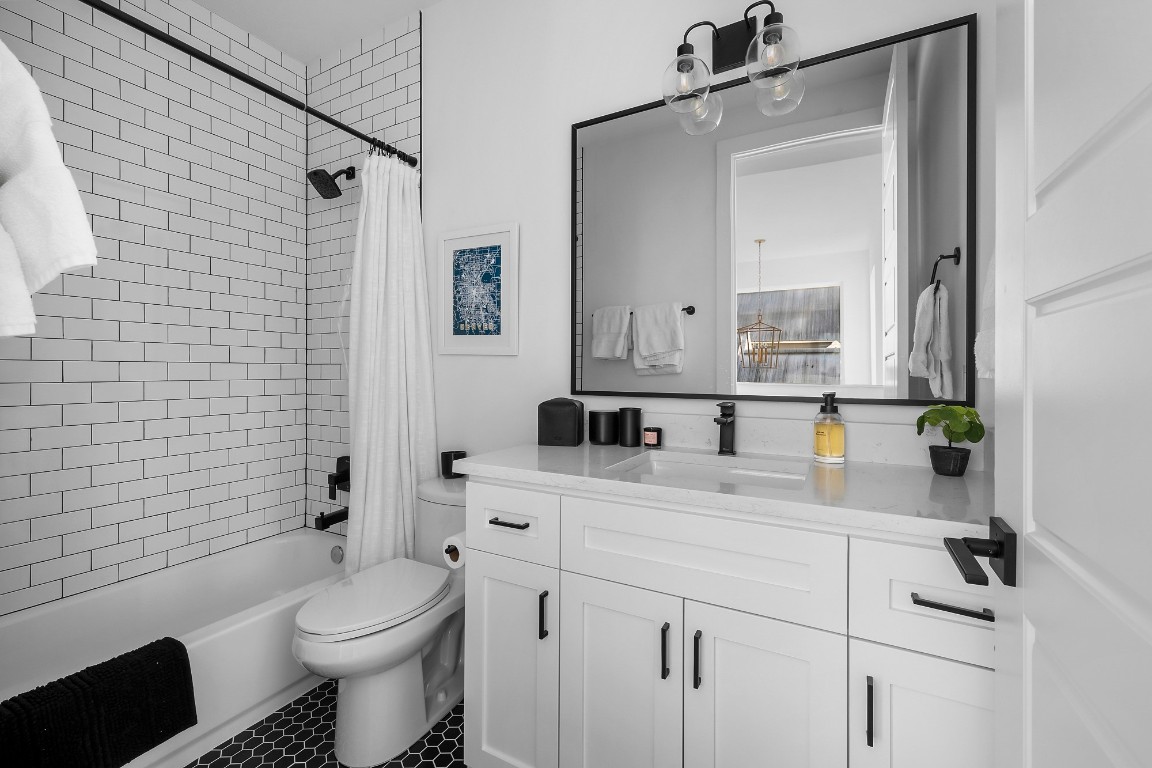 404 Powell Circle, Unit B Austin, TX 78704 - Photo 24 of 33 a bathroom with a sink a toilet and shower