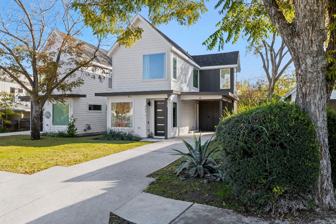 404 Powell Circle, Unit B Austin, TX 78704 - Photo 3 of 33 a front view of a house with swimming pool and porch