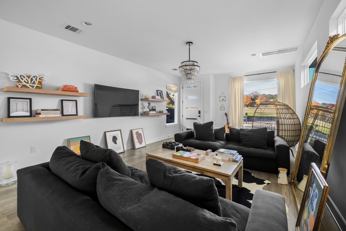 404 Powell Circle, Unit B Austin, TX 78704 - Photo 5 of 33 a living room with furniture a flat screen tv and a window