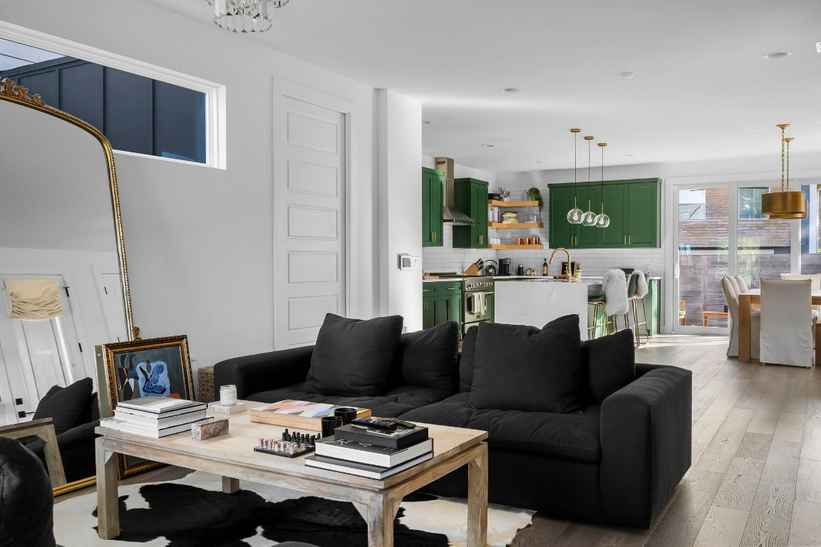 404 Powell Circle, Unit B Austin, TX 78704 - Photo 7 of 33 a living room with furniture a flat screen tv and a fireplace