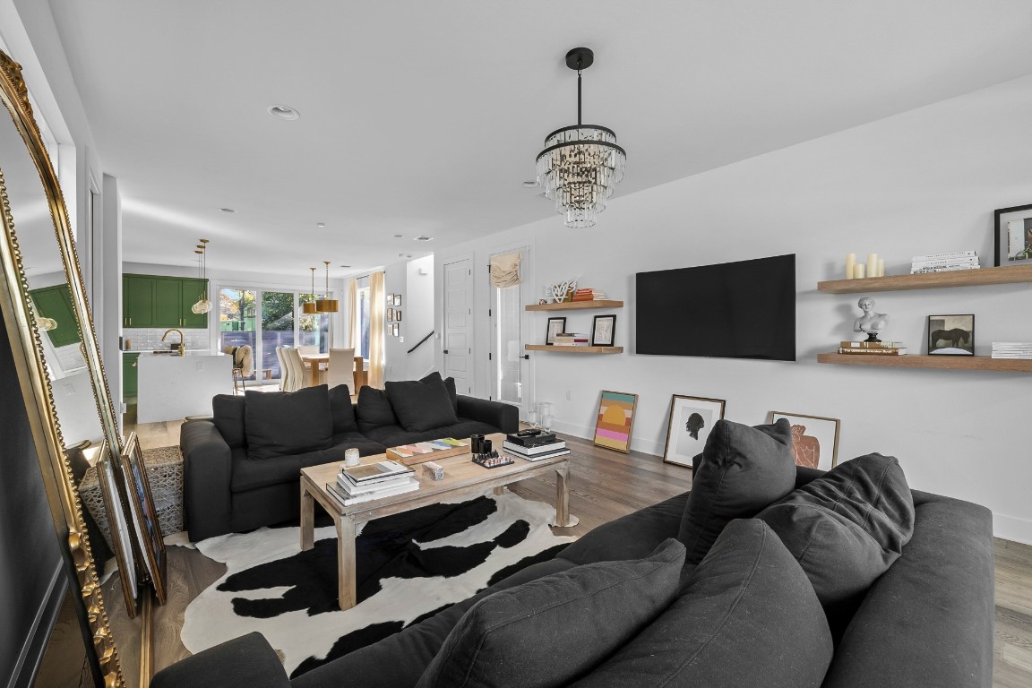 404 Powell Circle, Unit B Austin, TX 78704 - Photo 8 of 33 a living room with furniture a flat screen tv and kitchen view