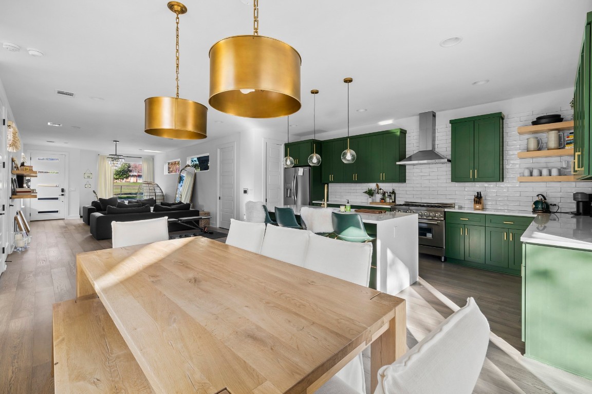 404 Powell Circle, Unit B Austin, TX 78704 - Photo 10 of 33 a kitchen with stainless steel appliances granite countertop a sink a stove and a refrigerator
