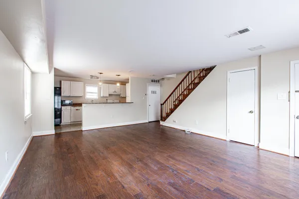a view of kitchen with wooden floor