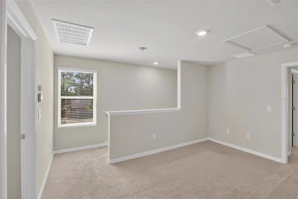 a bathroom with a granite countertop shower a mirror and a sink