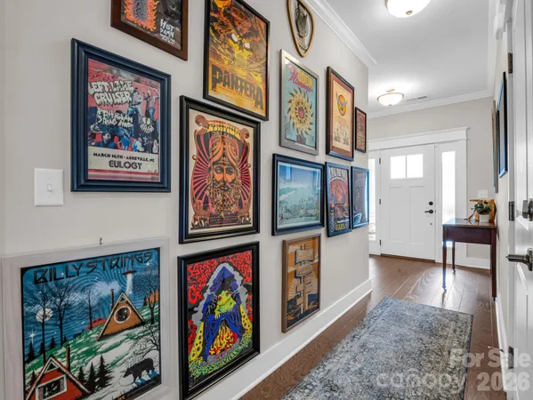 an aerial view of a house with a mountain