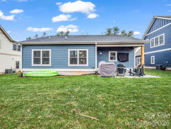 a front view of a house with a garden and yard