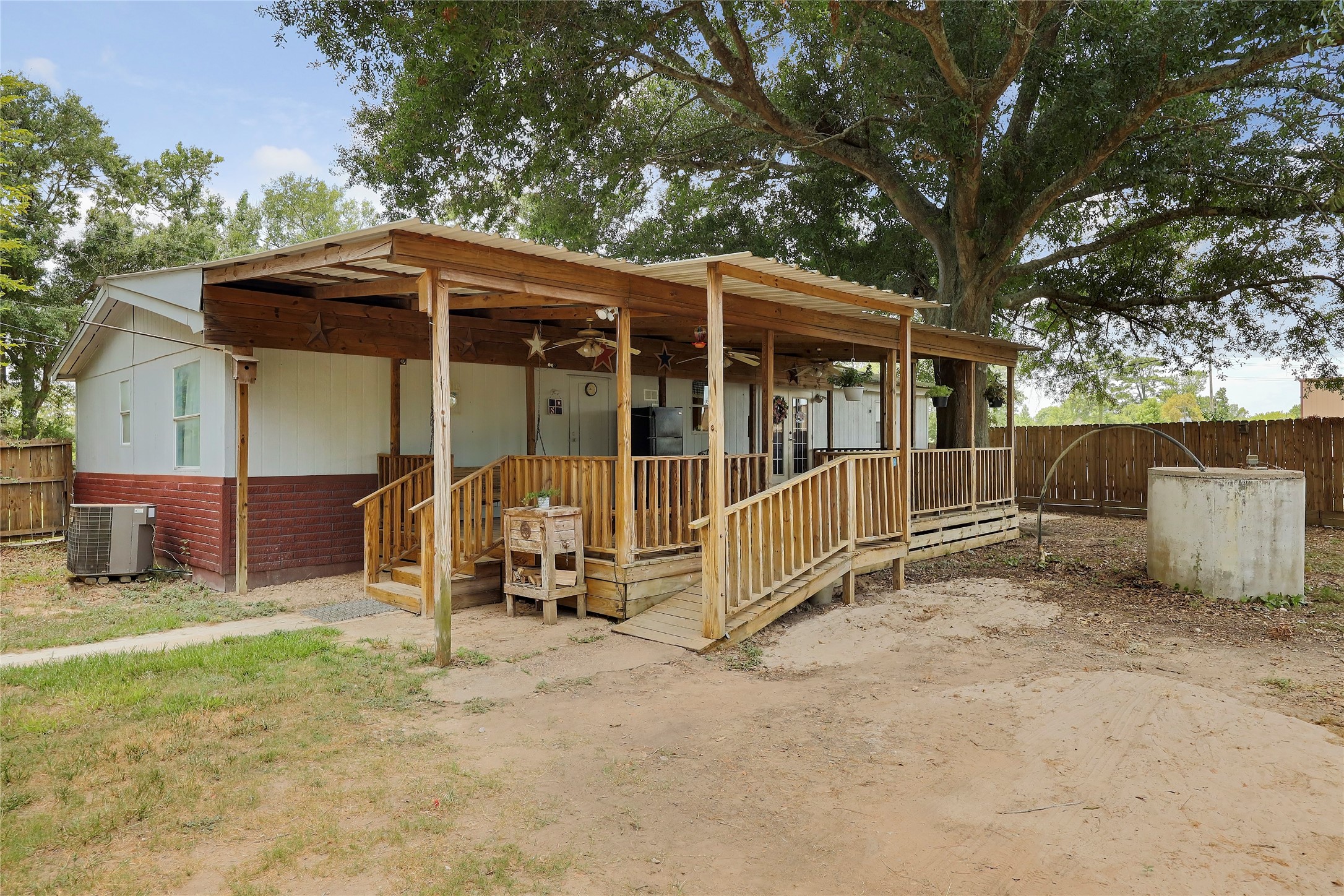 Tbd Wiggins Road Conroe, TX 77302 - Photo 9 of 16 a view of backyard with a barn and a large tree